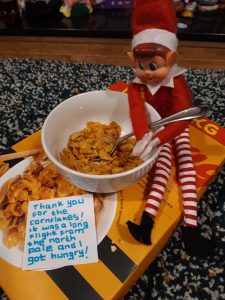 elf on the shelf eating cereal